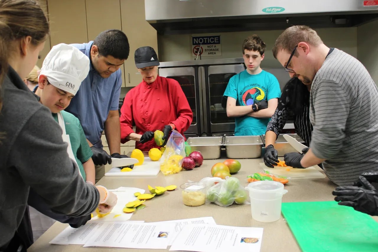 Cooking Creations participants preparing food together