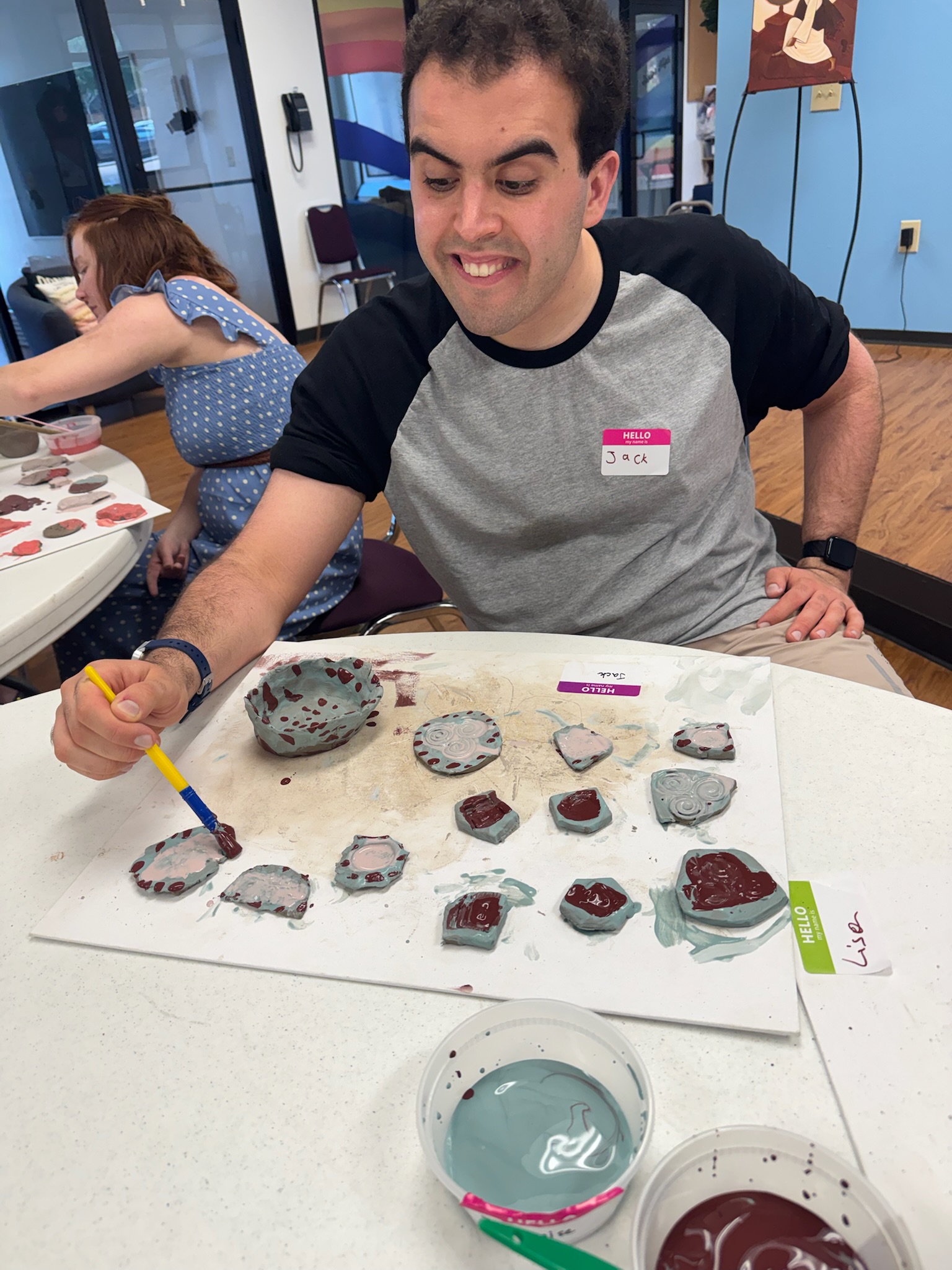 Clay Creations participants shaping ceramic art pieces